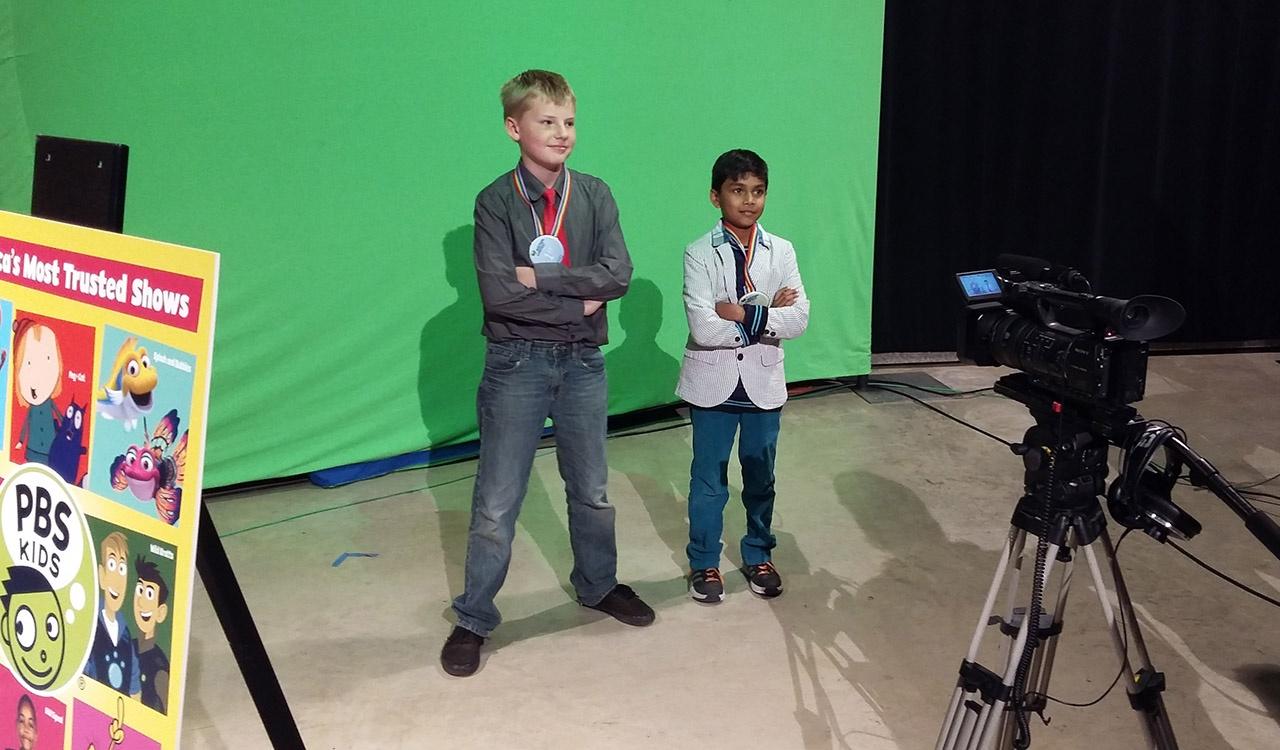 2017 Contest Winners Pose in front of green screen