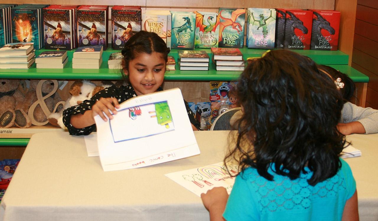 First Grade winner Akshara signing her book at Barnes and Noble