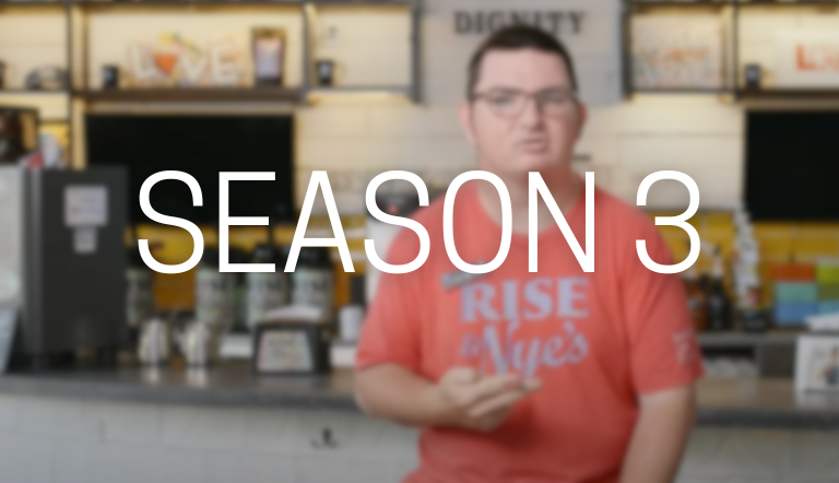 Season 3 Man in front of a coffee shop counter