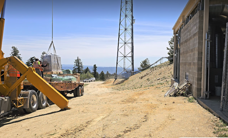 Engineers working on Deer Point transmitter in June, 2025