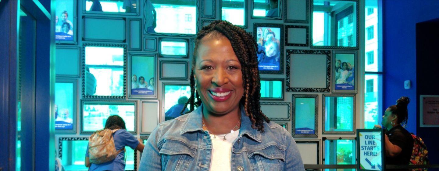 Deborah Holt Noel, host of NC Weekend in front a collage of frames.