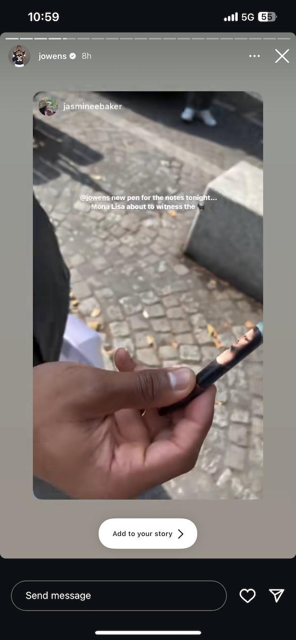 A screenshot of an Instagram Story post with a man's hand holding a pen