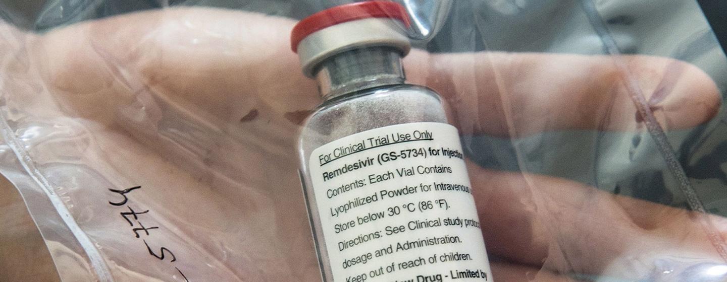 glass bottle of remdisivir covid antiviral treatment held in clear plastic bag