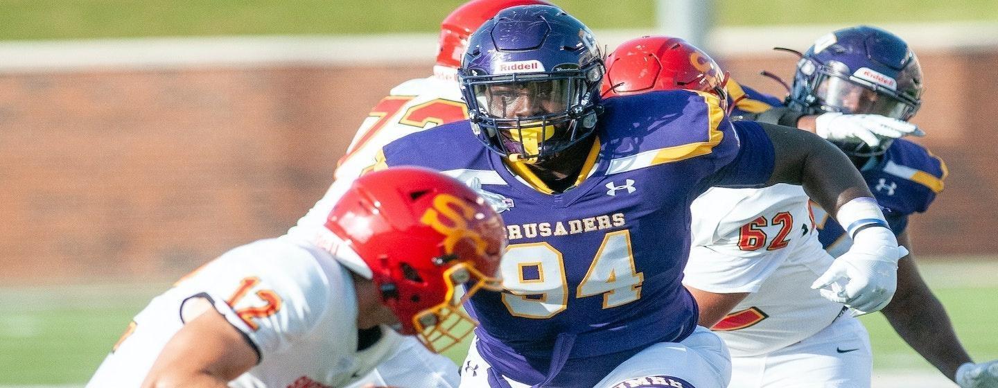 Football players from two teams in action on the field