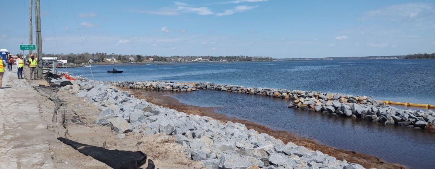 The shorelines of the ocean on a sunny day with few clouds in the sky.