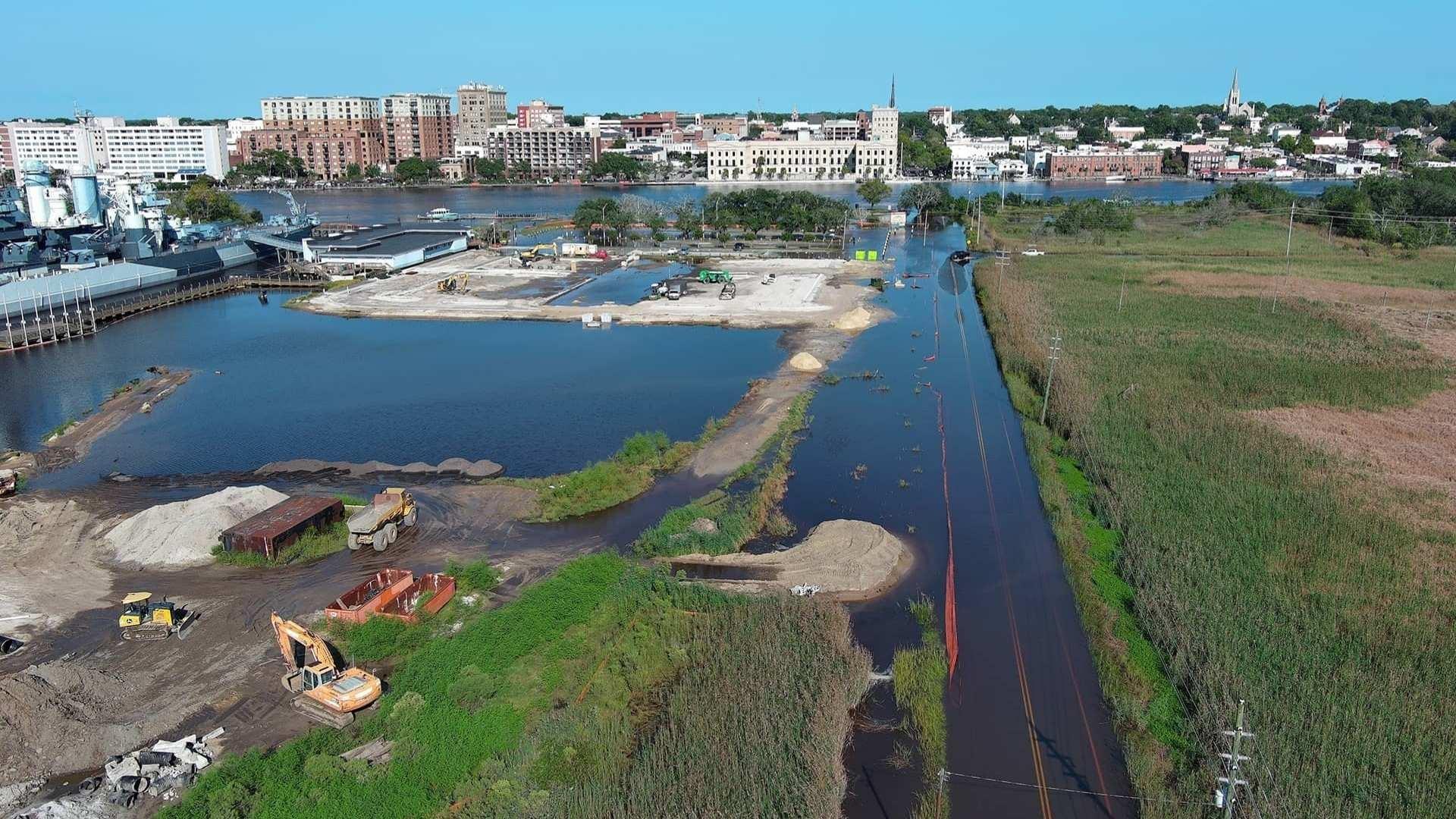 “Sunny day” flooding (flooding without rainfall) during a king tide period, when the moon is closest to the Earth, has inundated a former parking area and the road (on the right) leading to the battleship site. Photo courtesy of Dr. Devon Eulie.