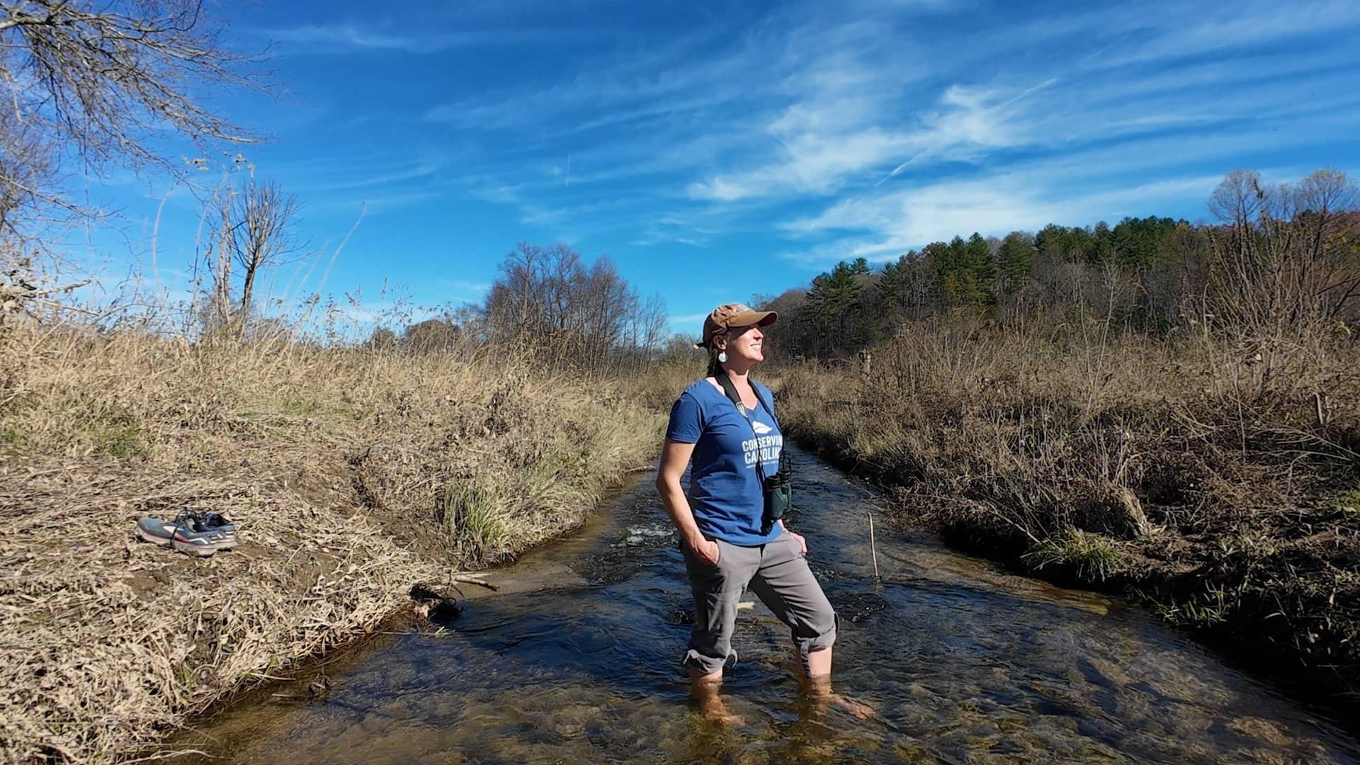 Rose Jenkins Lane in the restored creek at Pleasant Grove. Before restoration, this creek had been converted to a ditch to drain water off the land, which created problems with erosion.