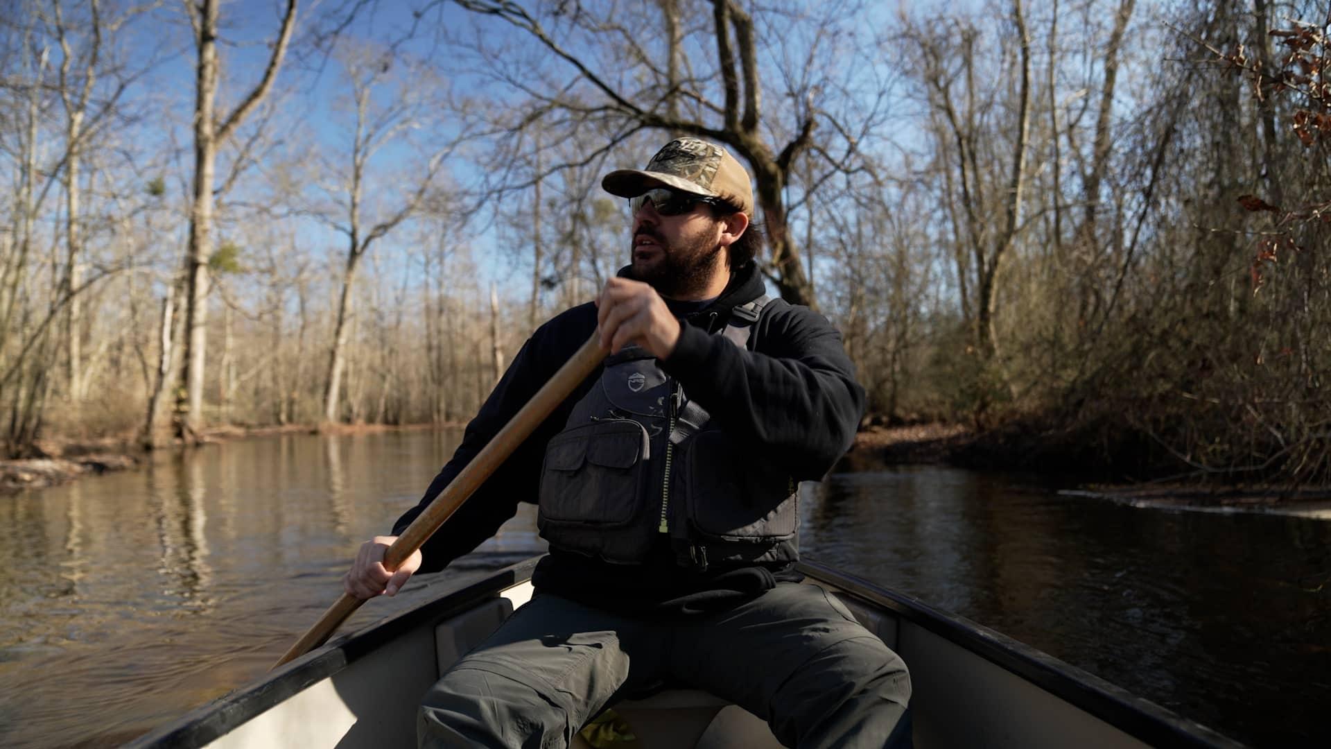 Kullen Bell paddles up the Great Coharie River in Sampson County toward a beaver dam.