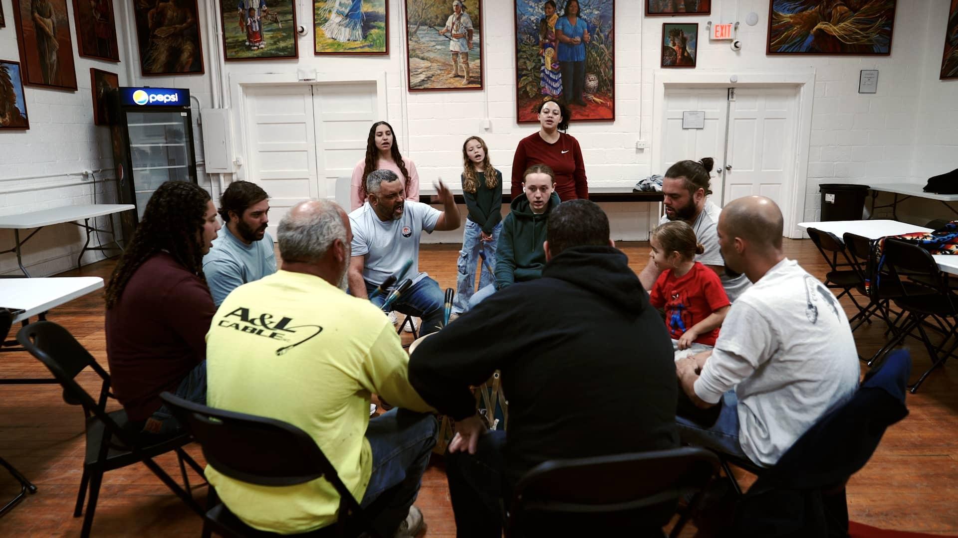 The Smokey River Singers and other members of the Coharie Tribe gather for drum practice.