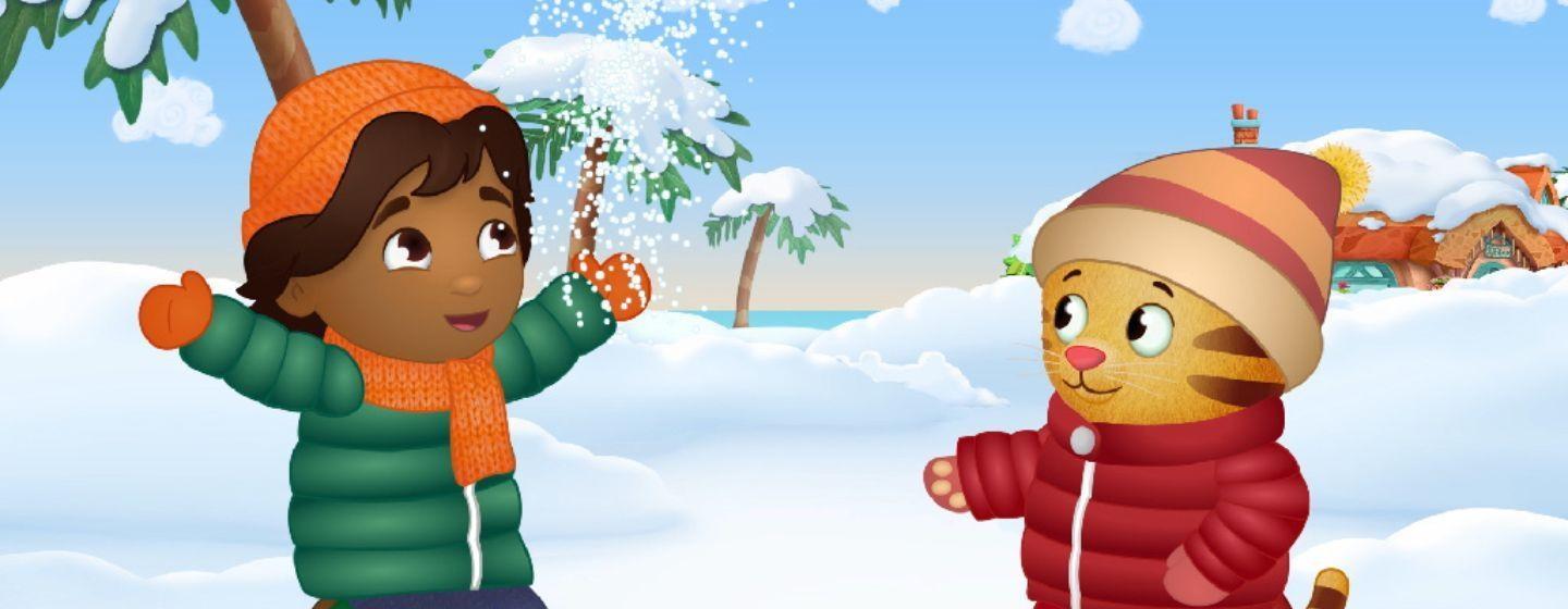 Daniel Tiger and Juan Carlos in the snow, wearing winter gear.