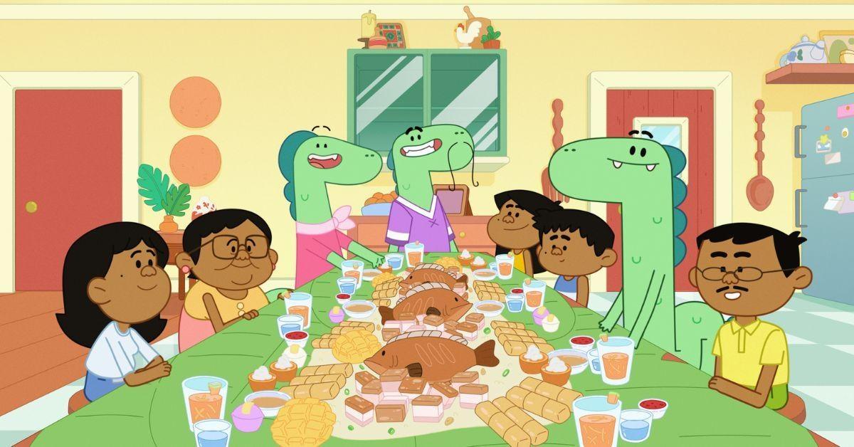 Jelly, Ben and Pogo sit around a dinner table full of food with their families.
