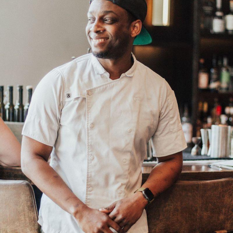 Cleophus Hethington smiling in his kitchen