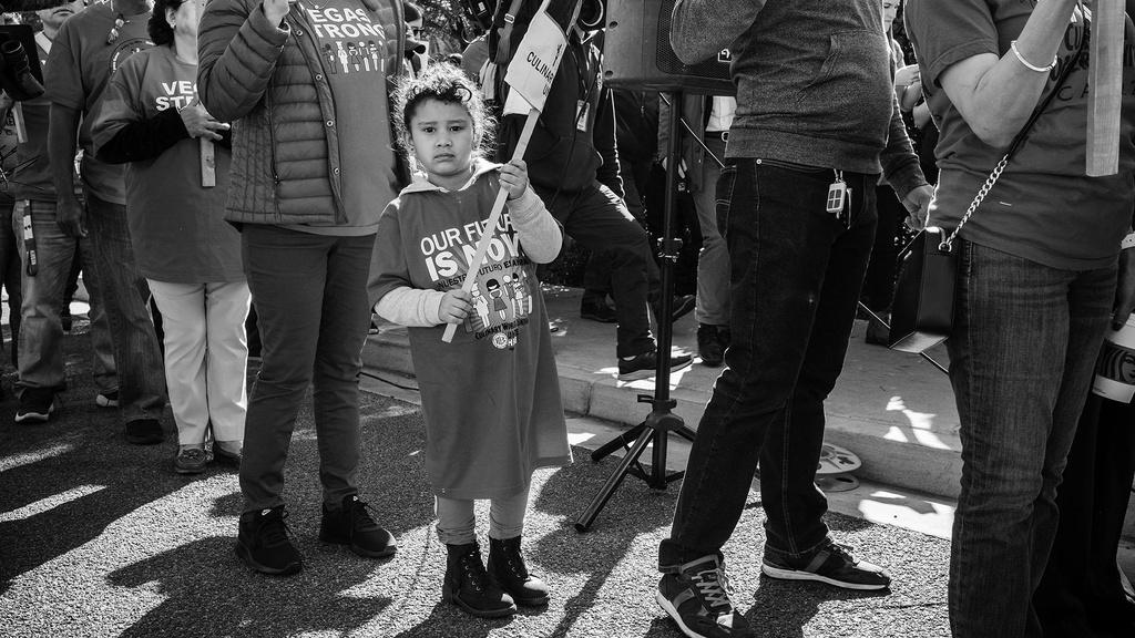 Young Latino girl takes part of the Culinary Union Picket Protest.