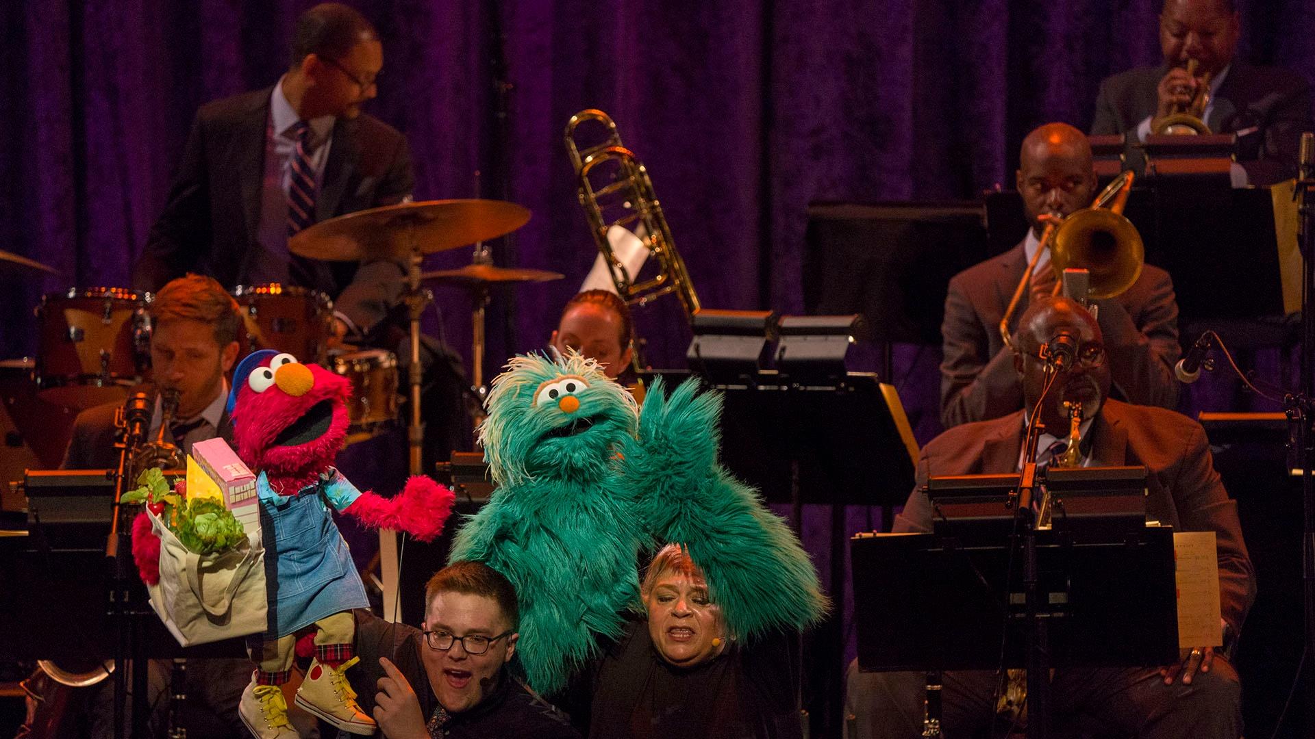 Elmo and Rosita perform "The People in Your Neighborhood" with the Jazz at Lincoln Center Orchestra.