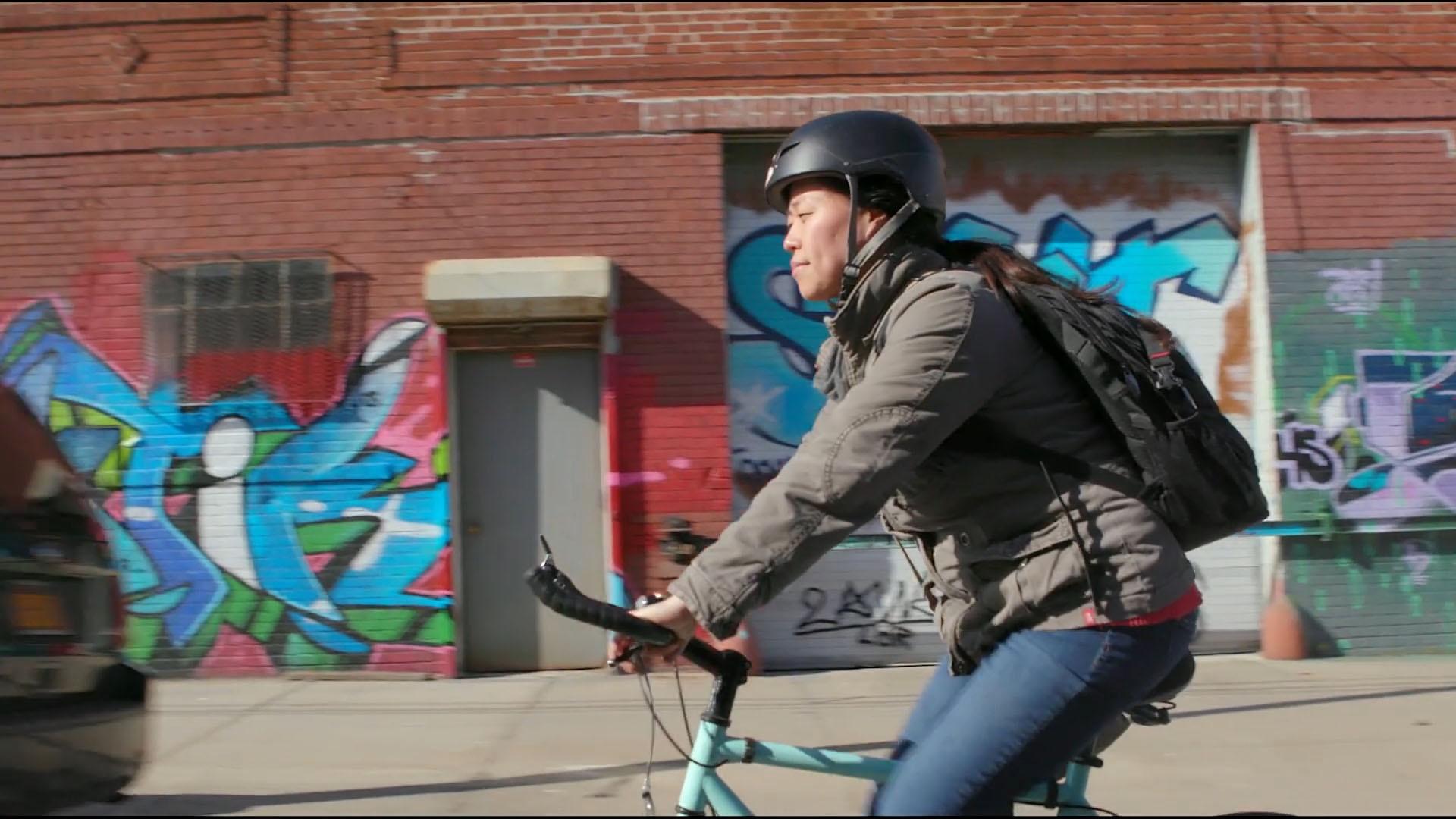 Kyung Jeon-Miranda rides her bike through Williamsburg, Brooklyn.