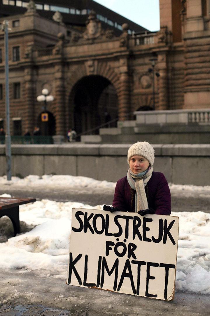 Greta Thunberg holding sign in Stockholm, Sweden.