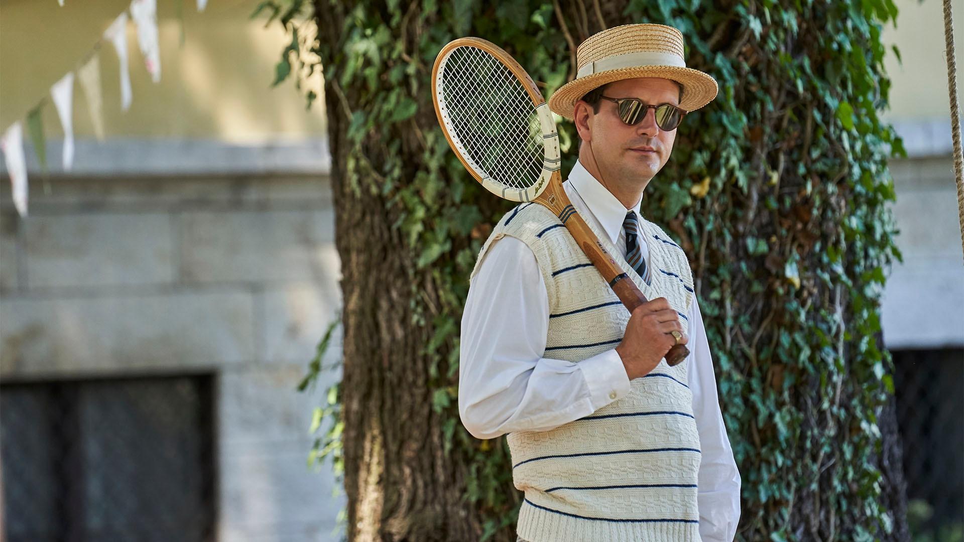 Dominic Tighe as Pelham Wingfield with his winning tennis racket. 