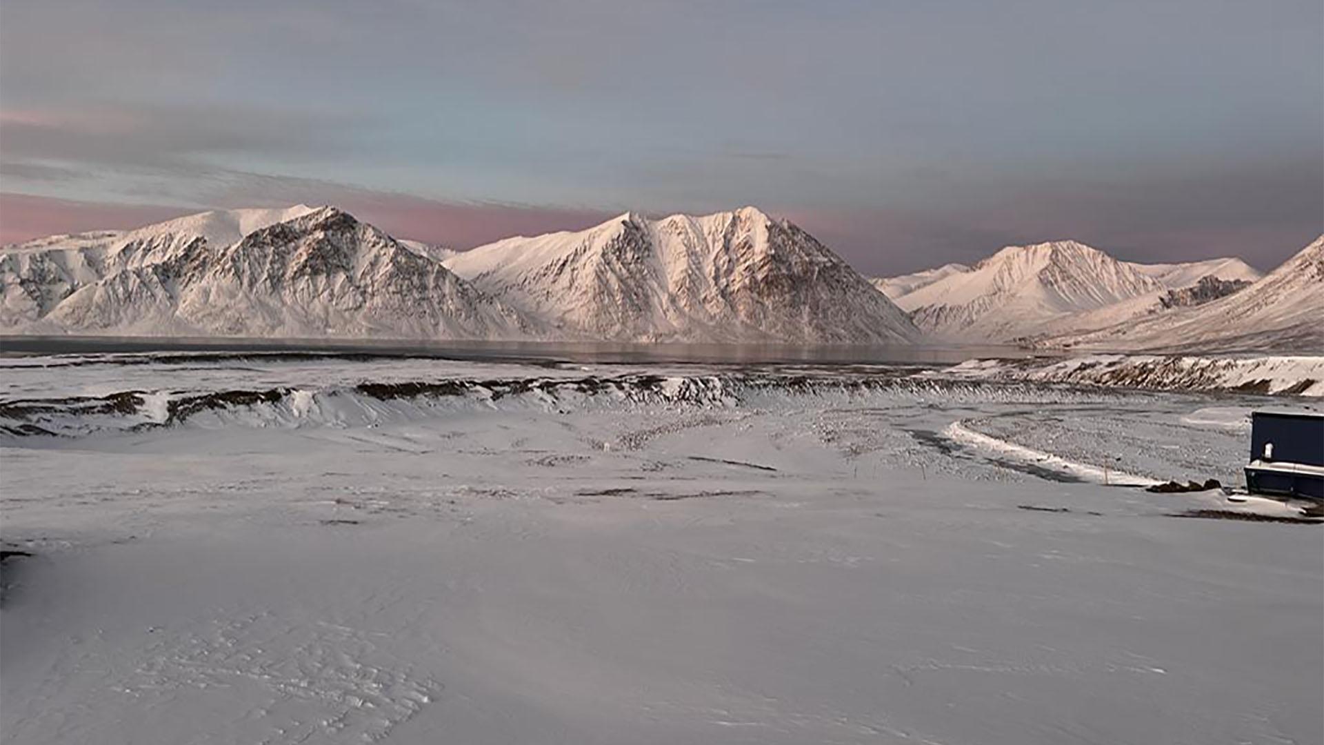 Image of a snow-covered mountain landscape in Greenland.