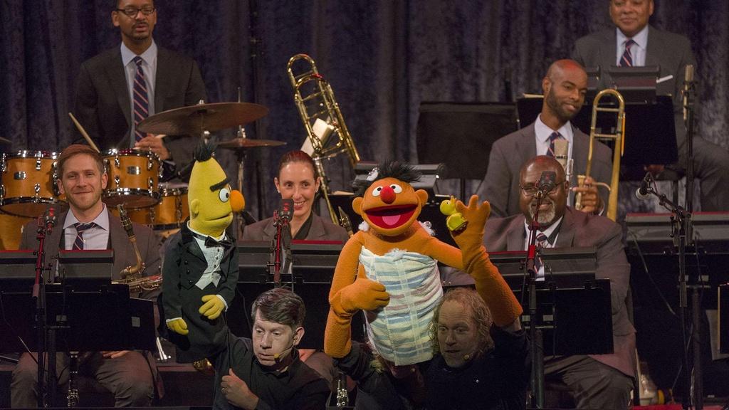 Image of Bert and Ernie on stage with the Jazz at Lincoln Center Orchestra.