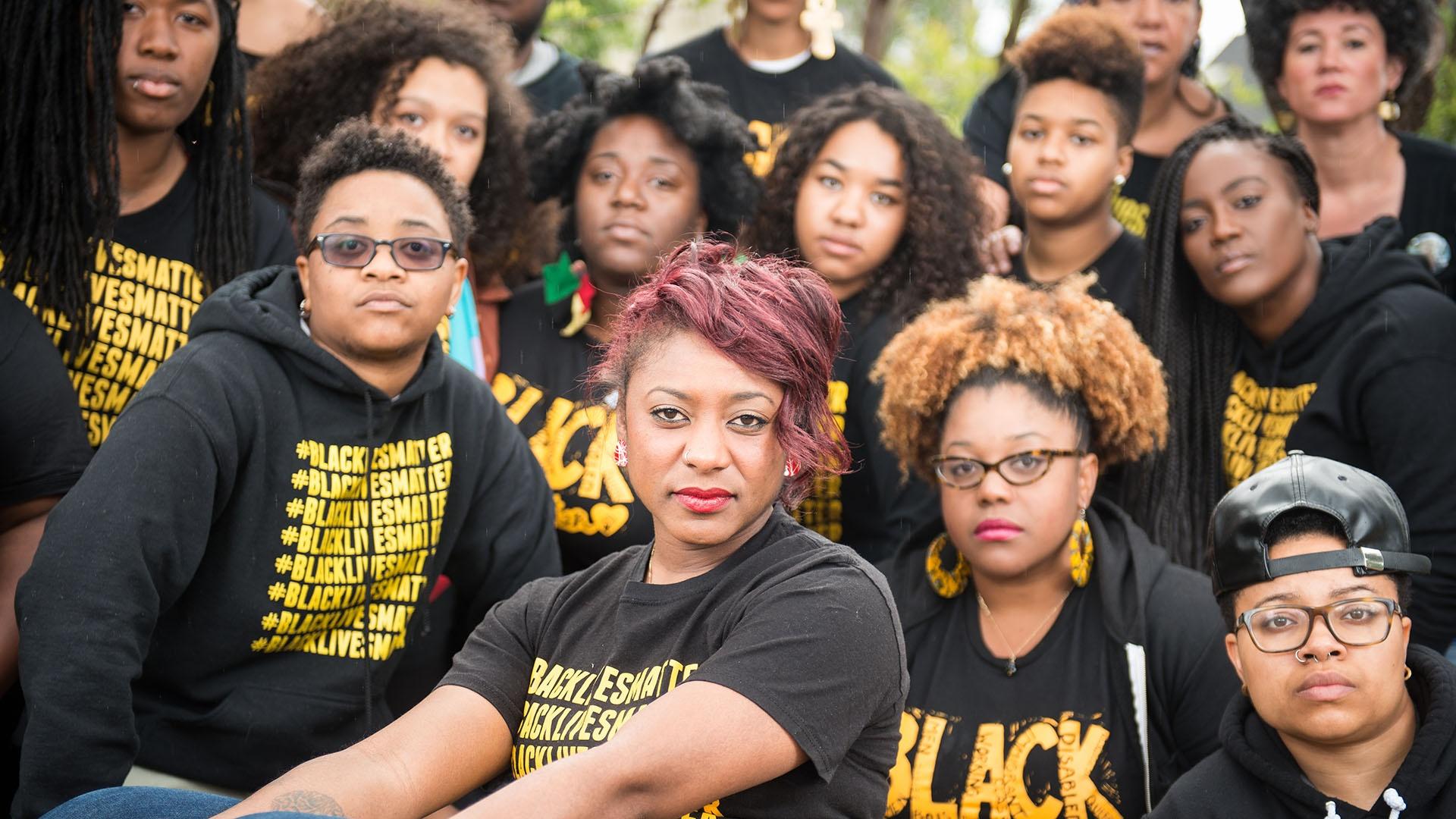 Political strategist and co-founder of Black Lives Matter, Alicia Garza, with fellow activists.