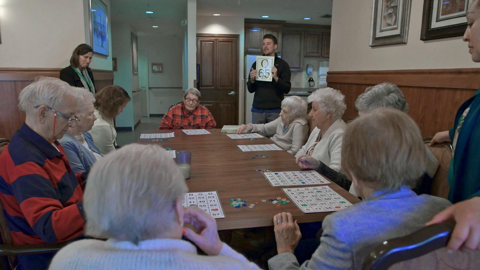 Mickey McGuinness tries his hand calling the numbers for Bingo at a retirement home.