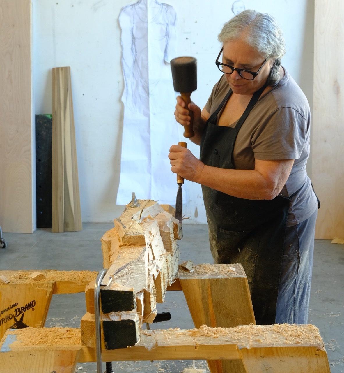 Alison Saar chisels a block of wood