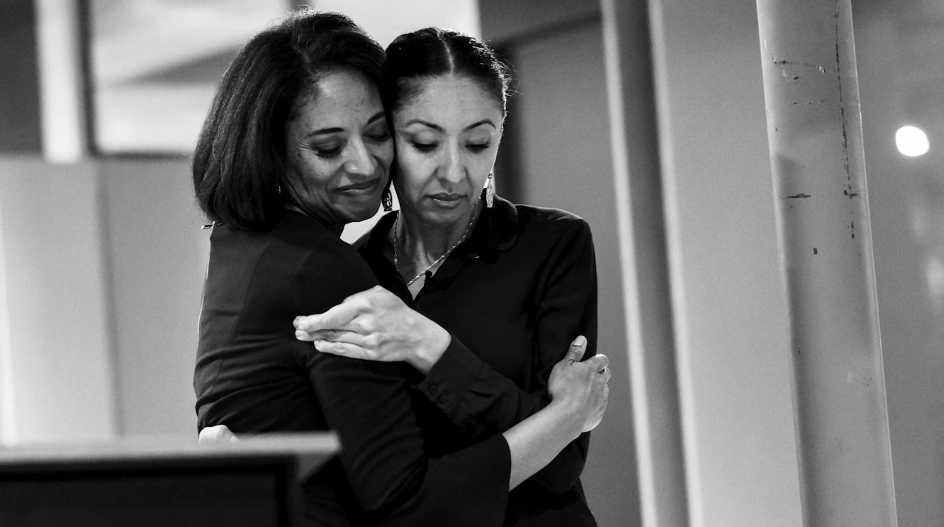 Candi CdeBaca and Dr. Lisa Calderón embrace during the Denver local elections. 