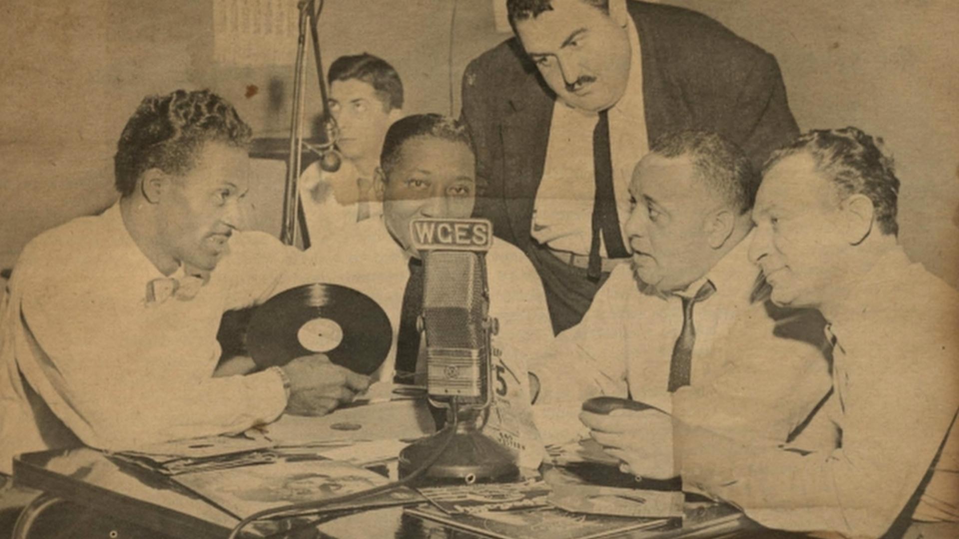 Chuck Berry with early radio executives, disk jockeys and Chess Records founder Leonard Chess.