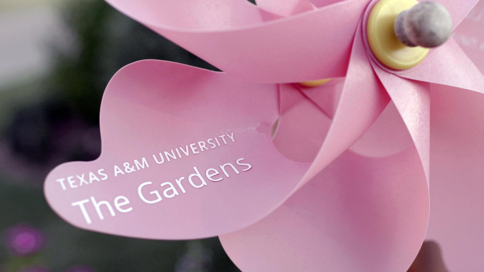 pink pinwheel with "Texas A&M University The Gardens written on it"