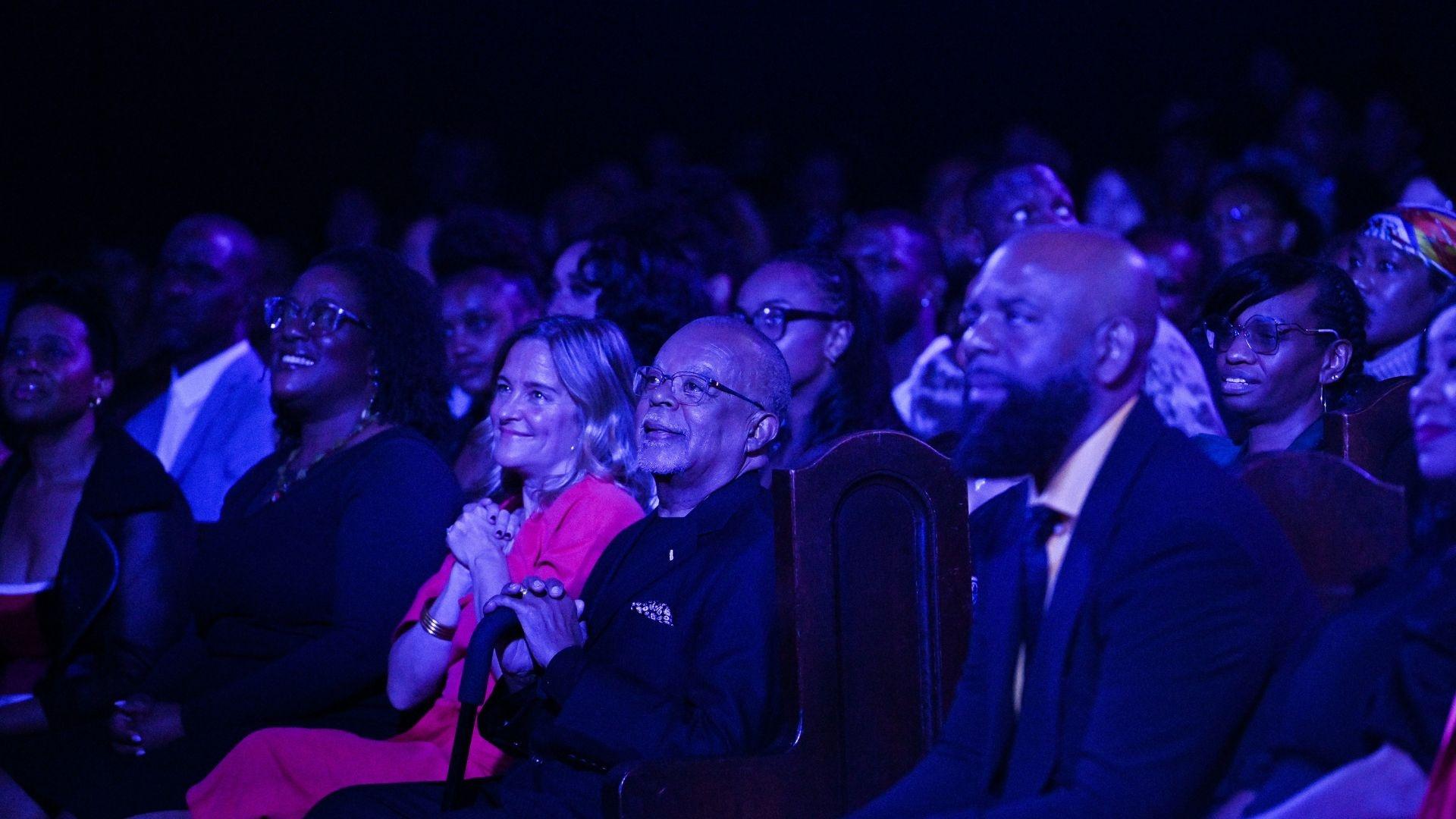 Henry Louis Gates, Jr. and Dyllan McGee sitting in the audience at GOSPEL Live! 