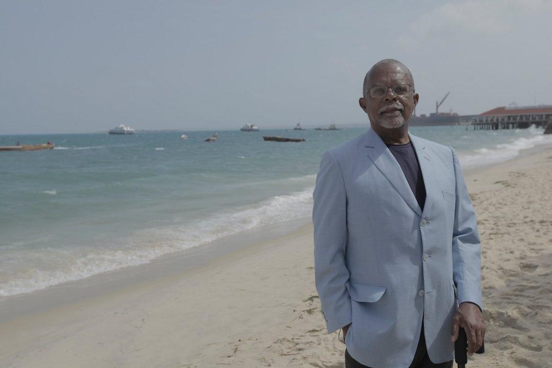 Henry Louis Gates, Jr. stands on a beach in Zanzibar, a semi-autonomous area of Tanzania.
