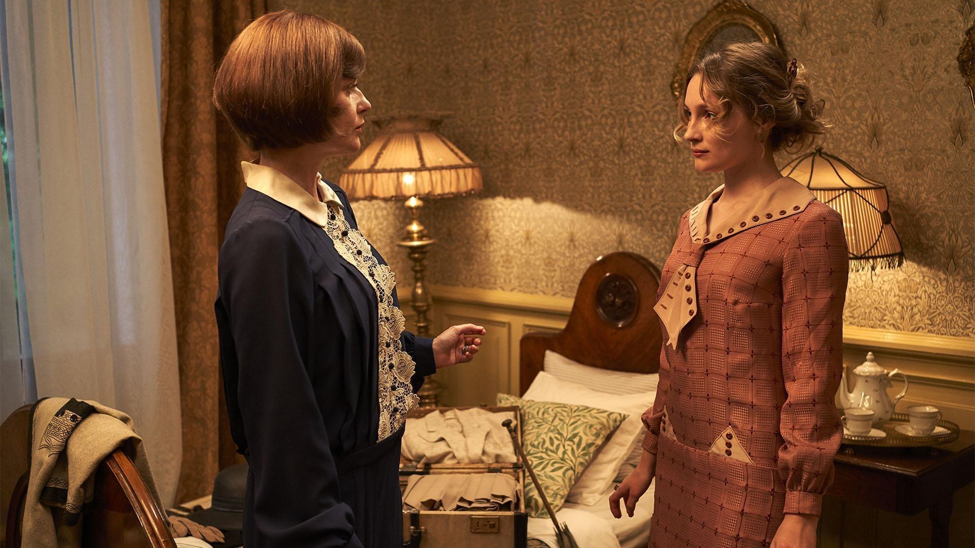Julia (Lucy Akhurst) scrutinizes Rose (Claude Scott-Mitchell) with little maternal warmth. 