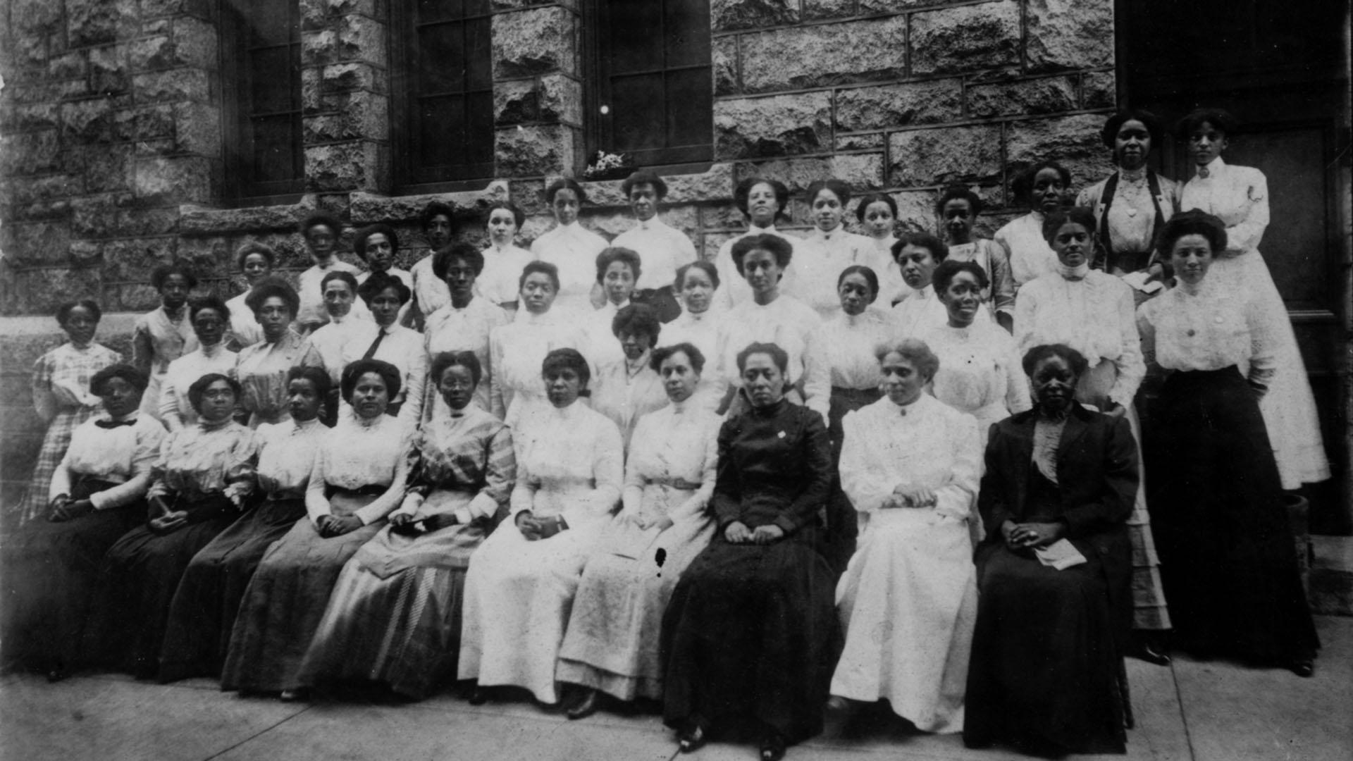 Black and white photo of female graduates