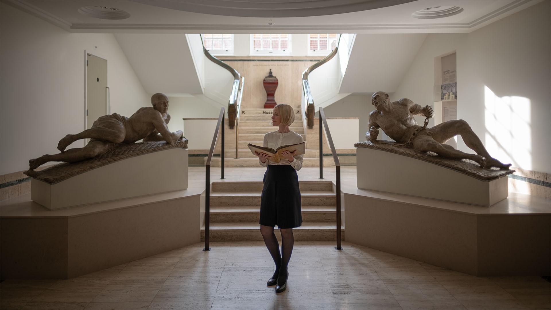 Lucy with book at Bethlem Museum of the Mind. 