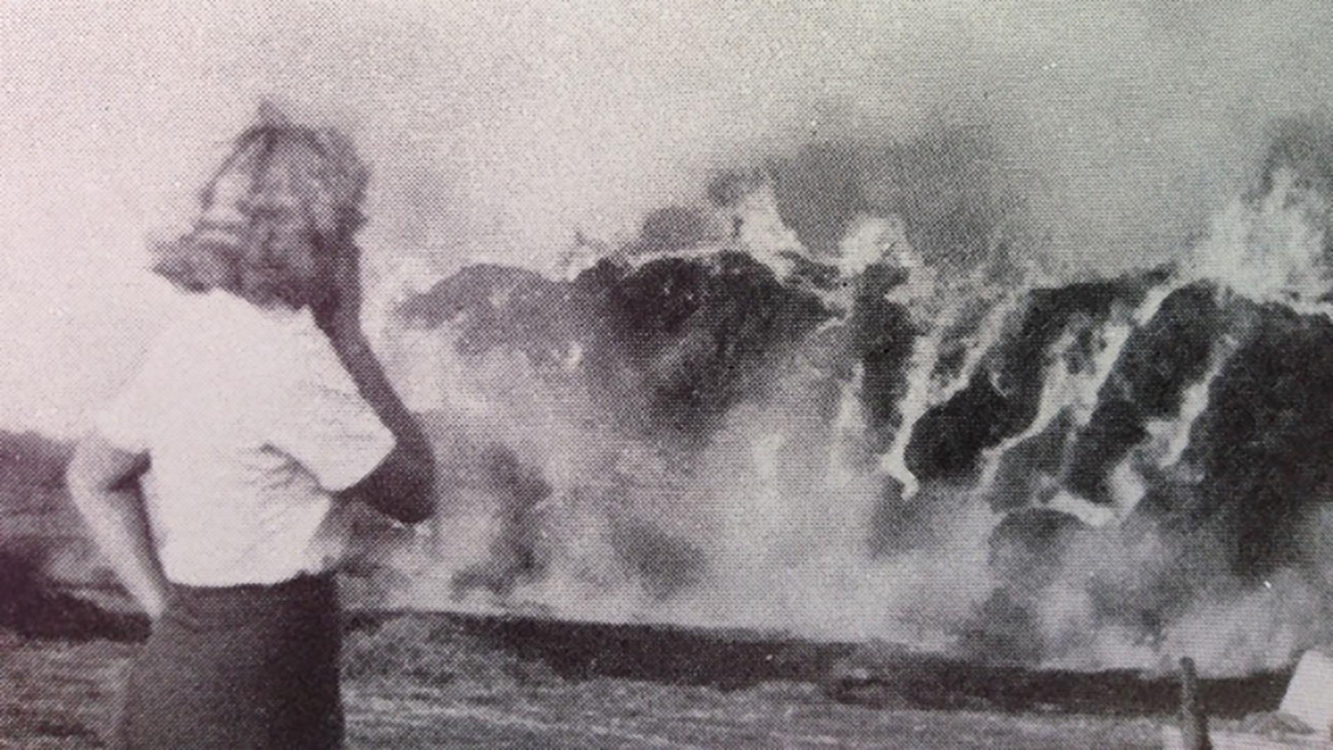 Black and white image of Maria watching the devastation of the Phosphor bombs.