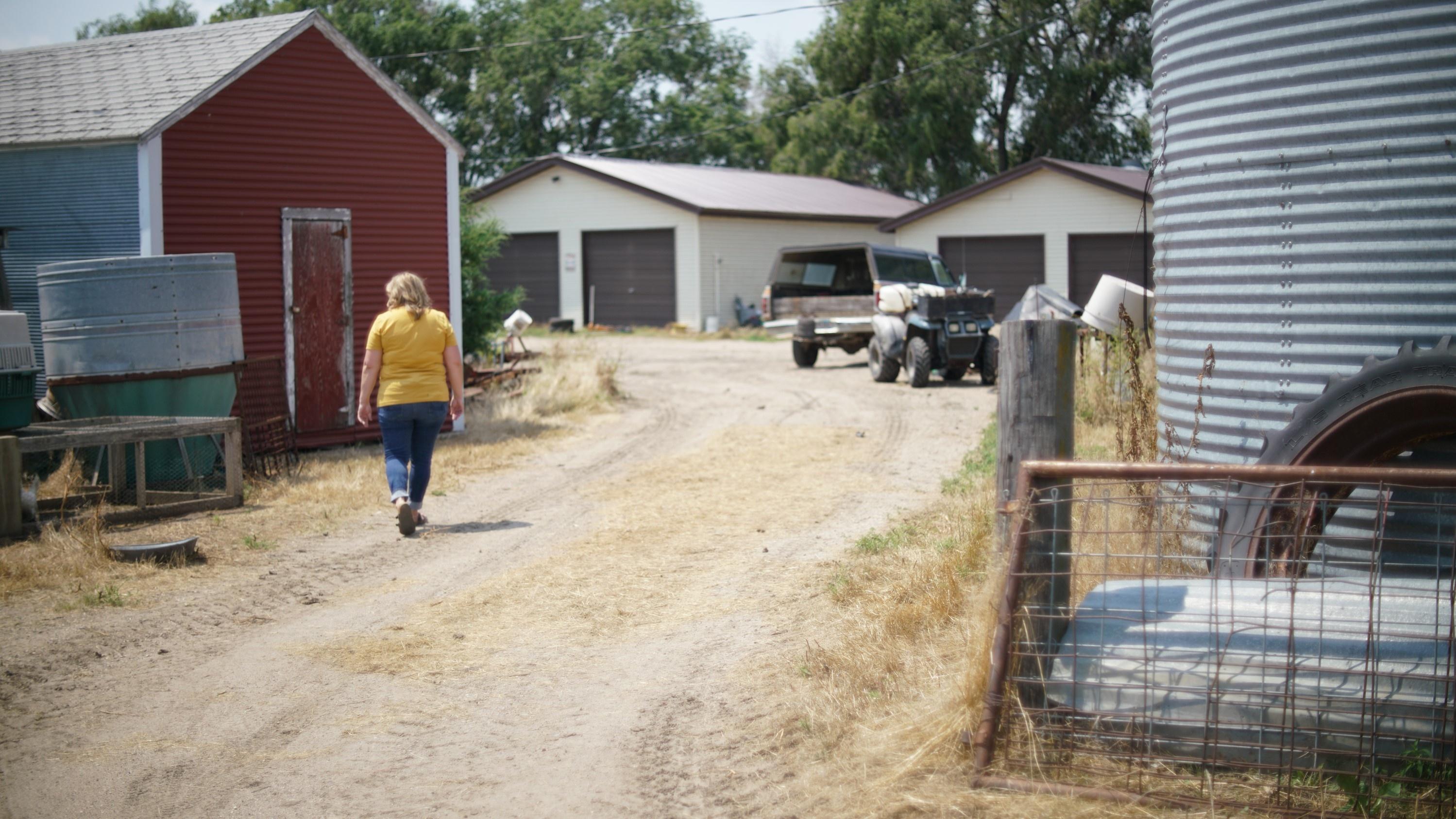 Amber Dykshorn walks around her family farm.