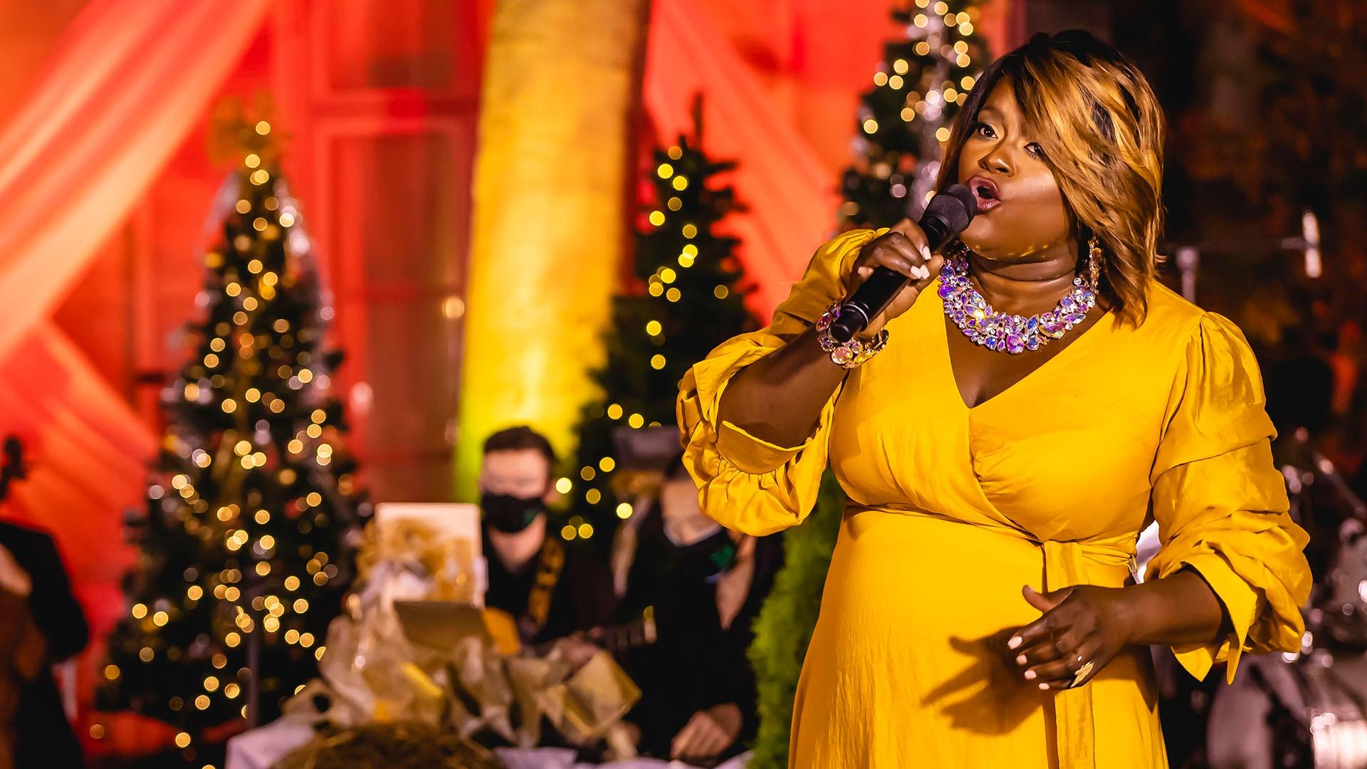Image of Nova Y. Payton performing "Rudolph the Red-Nosed Reindeer."