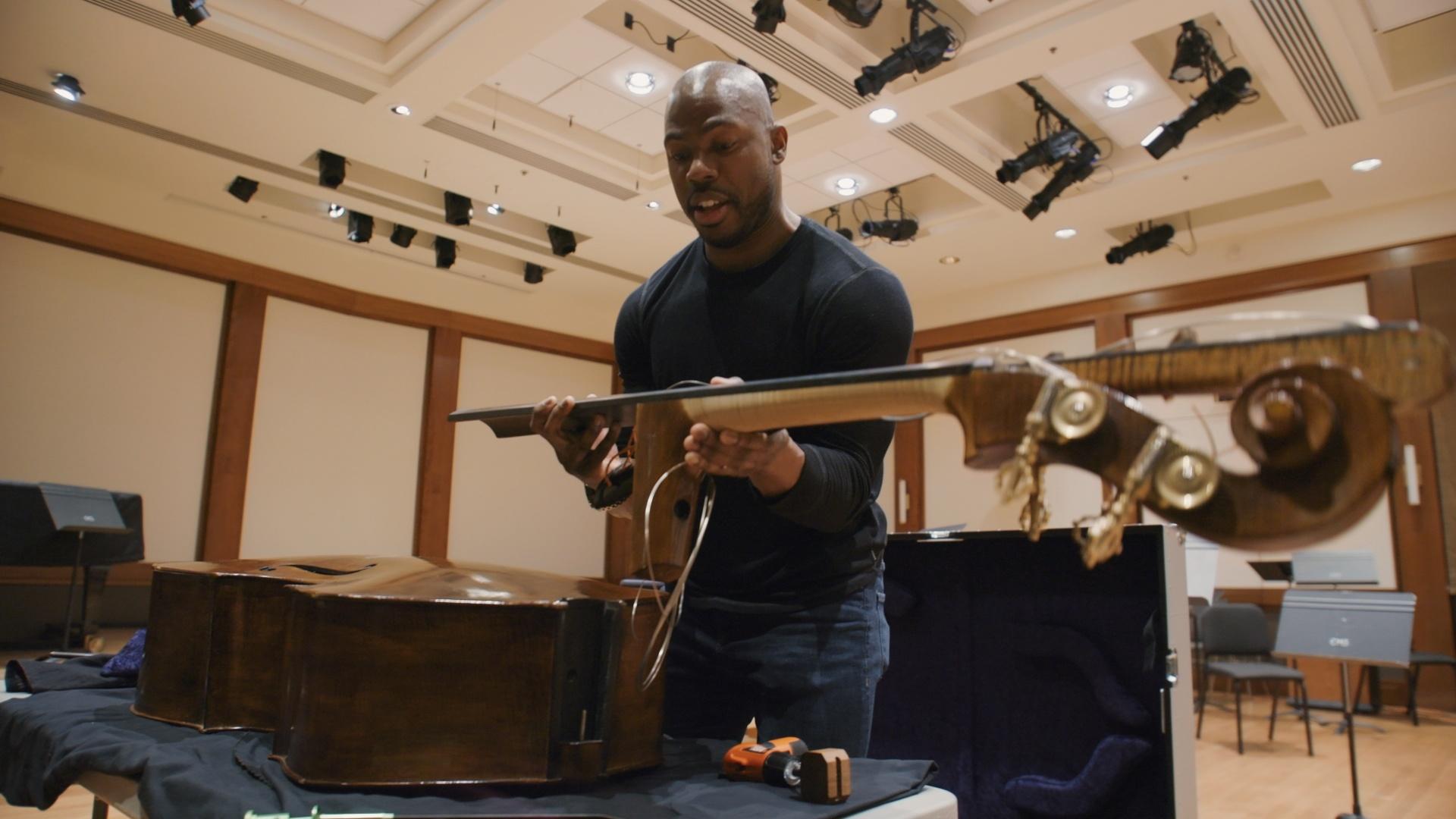 Chamber Music Society of Lincoln Center artist Joseph Conyers packs his double bass. 