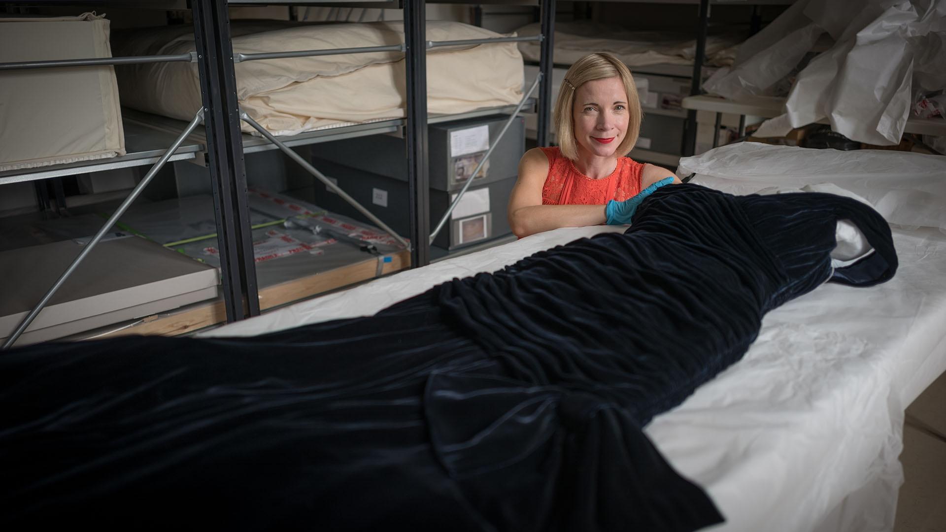 Lucy Worsley with the velvet dress worn by Princess Diana when she danced with John Travolta.
