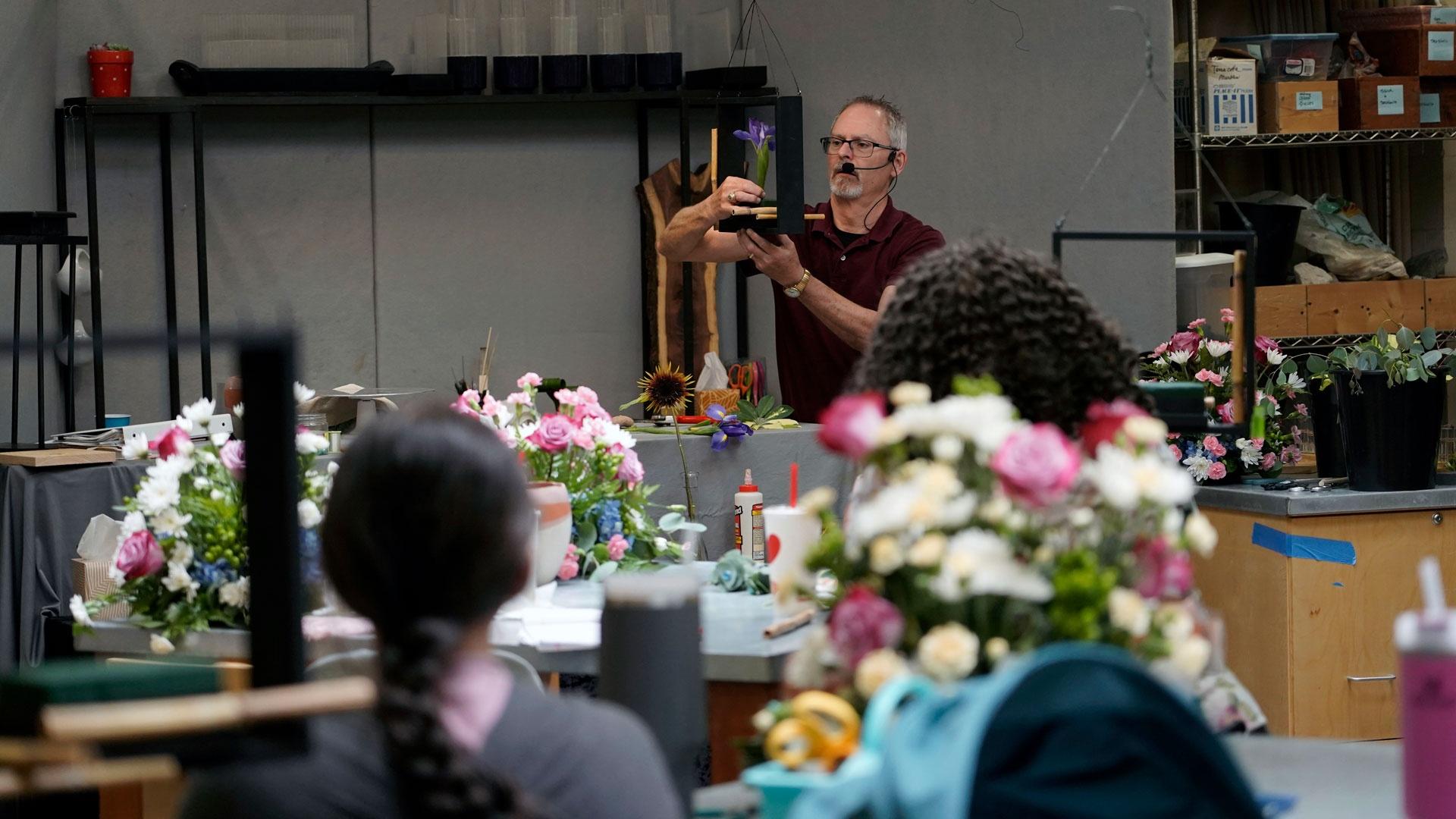 Floral design professor Bill McKinley demonstrates an arrangement for his class, as featured on Season 2 of "Texas A&M Today."