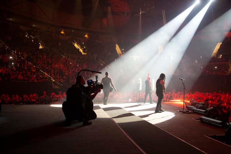Christopher Ewers (Director of Photography) onstage filming a Disturbed concert. 