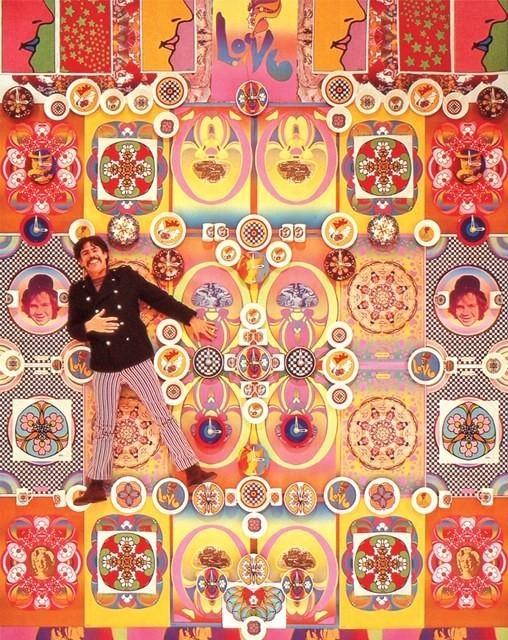 Peter Max with his poster and clock art in the late 1960s in New York City