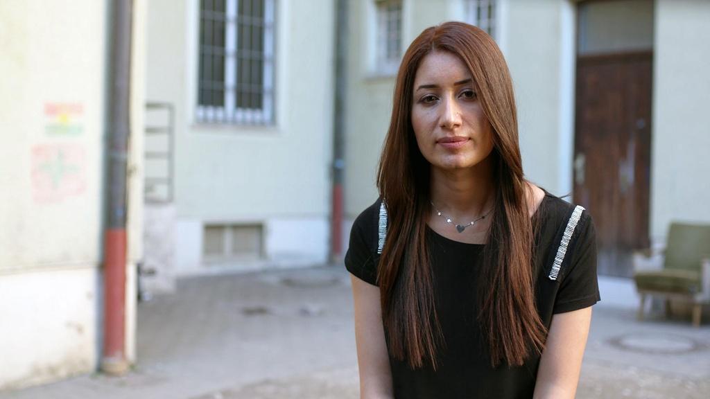 Image of a young Yazidi women who will be blessed in Lalish.