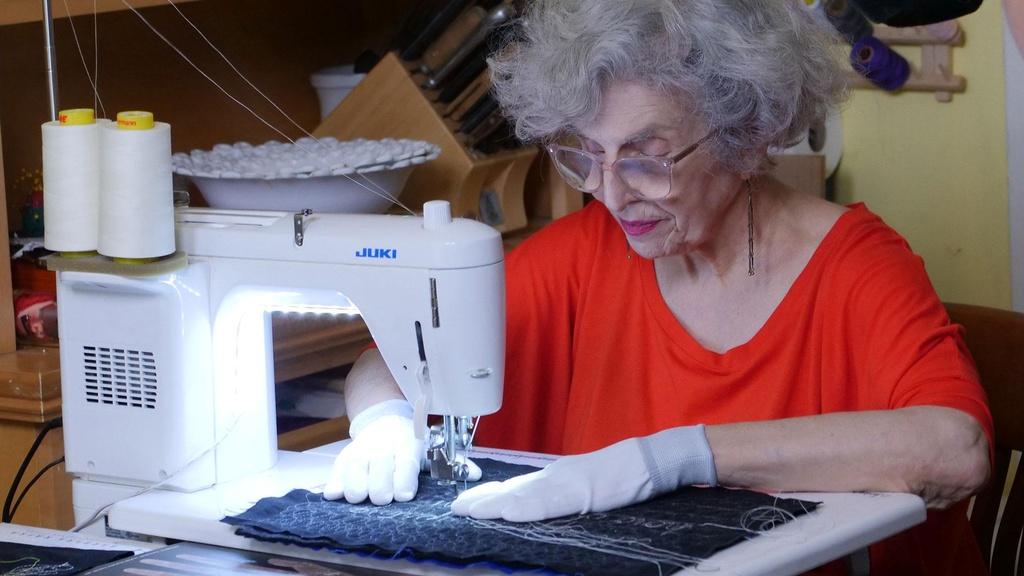Textile artist Linda Mendelson at the sewing machine. Craft in America STORYTELLERS