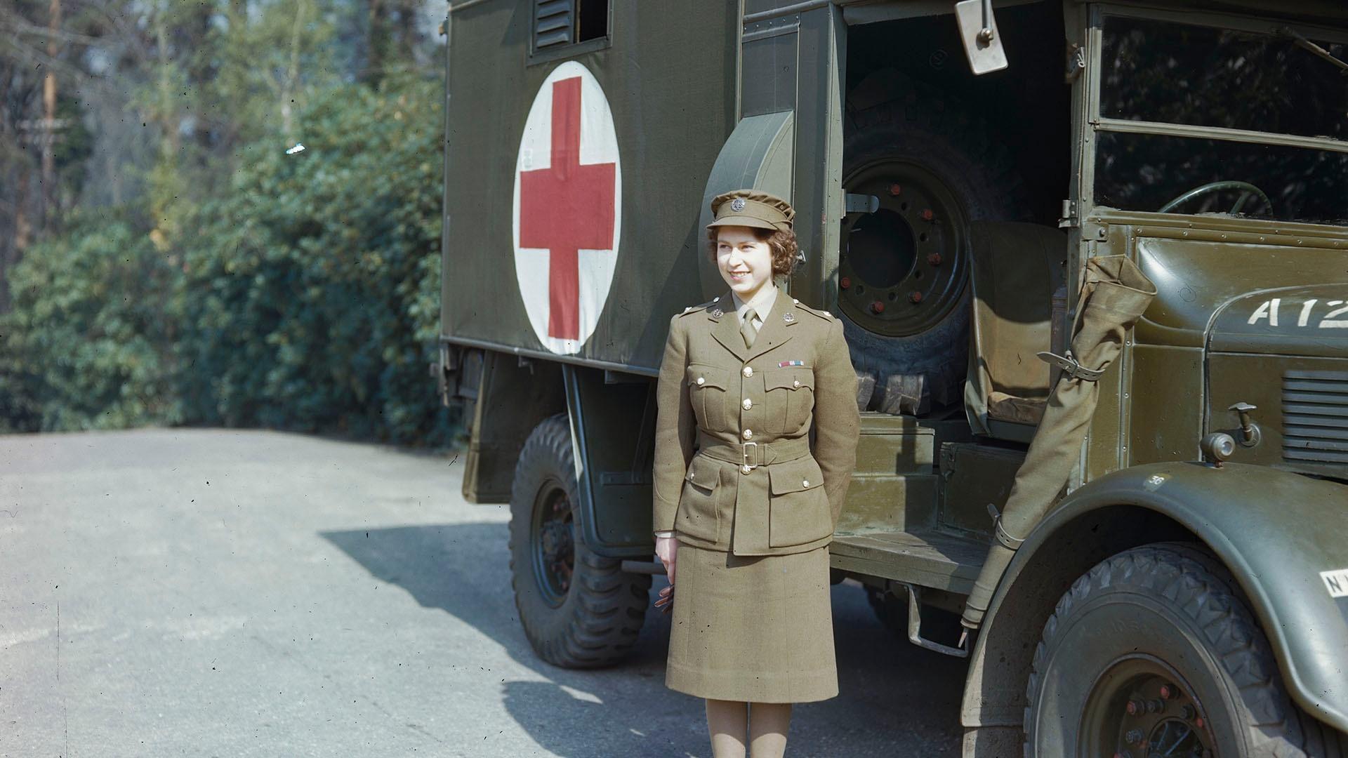 Princess Elizabeth, a 2nd Subaltern in the ATS standing in front of an ambulance.