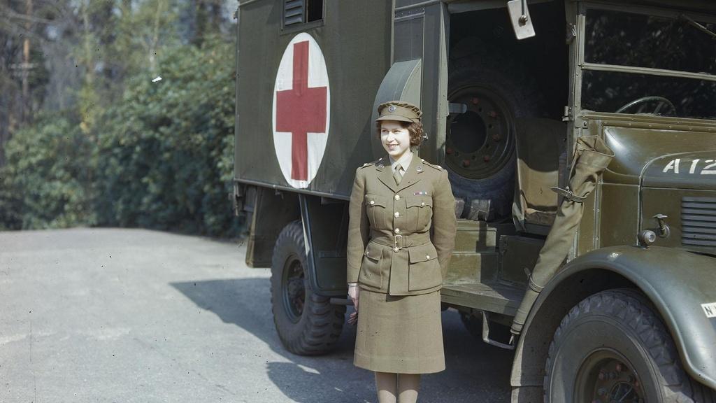Princess Elizabeth, a 2nd Subaltern in the ATS standing in front of an ambulance.