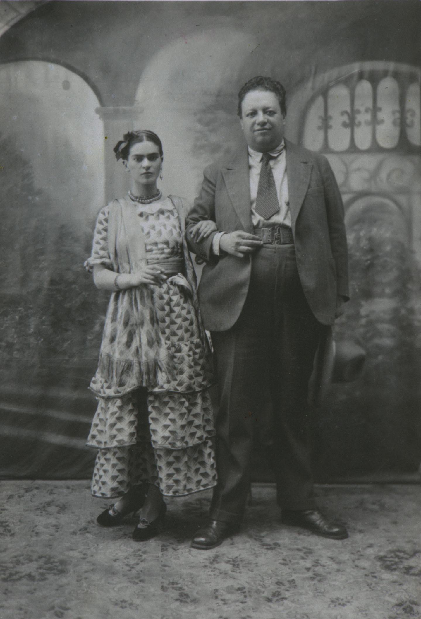 Wedding portrait of Frida Kahlo and Diego Rivera, August 21, 1929. Kahlo is holding a cigarette.