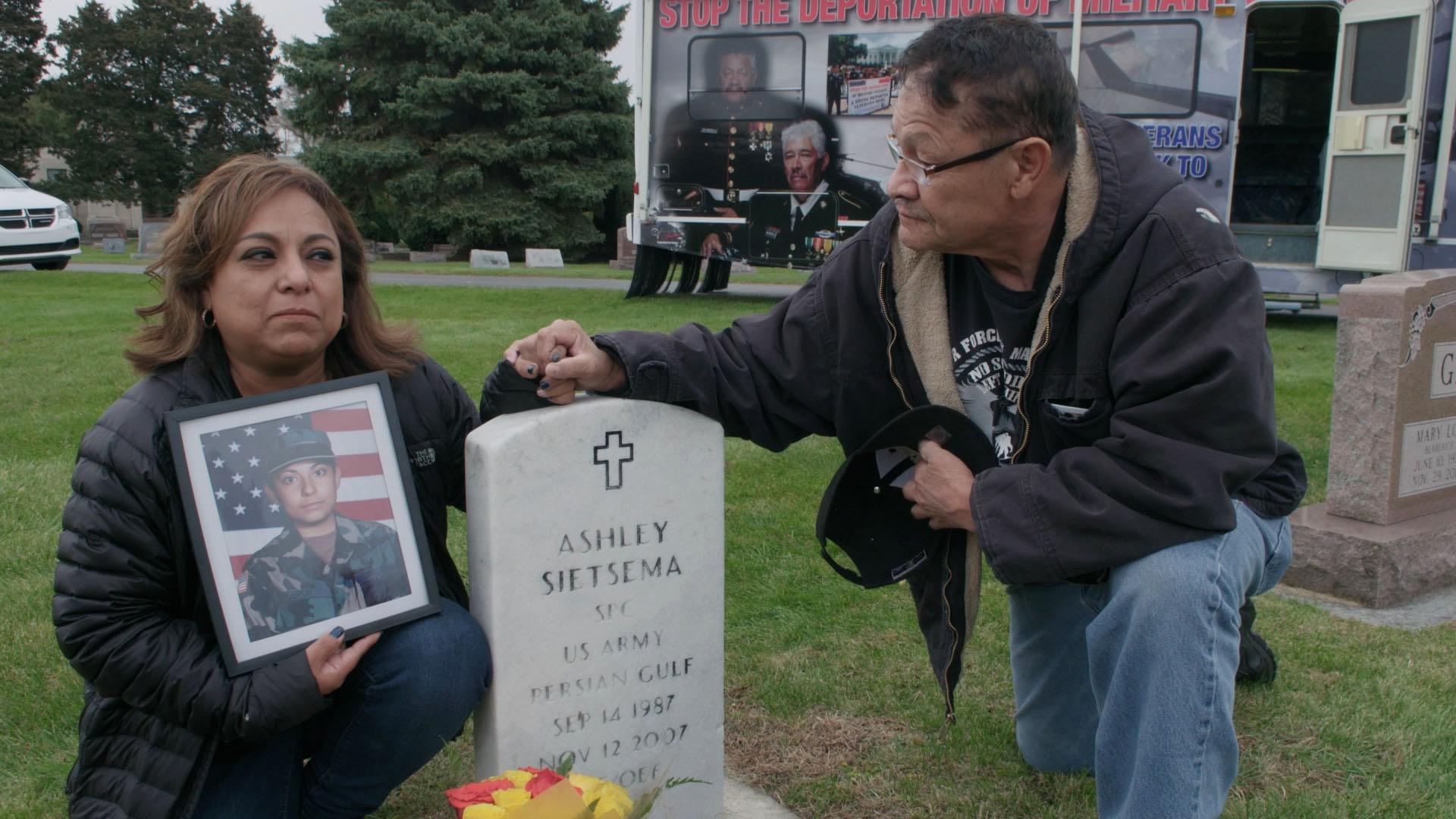 Olivia Segura and Manuel at her daughter's grave.