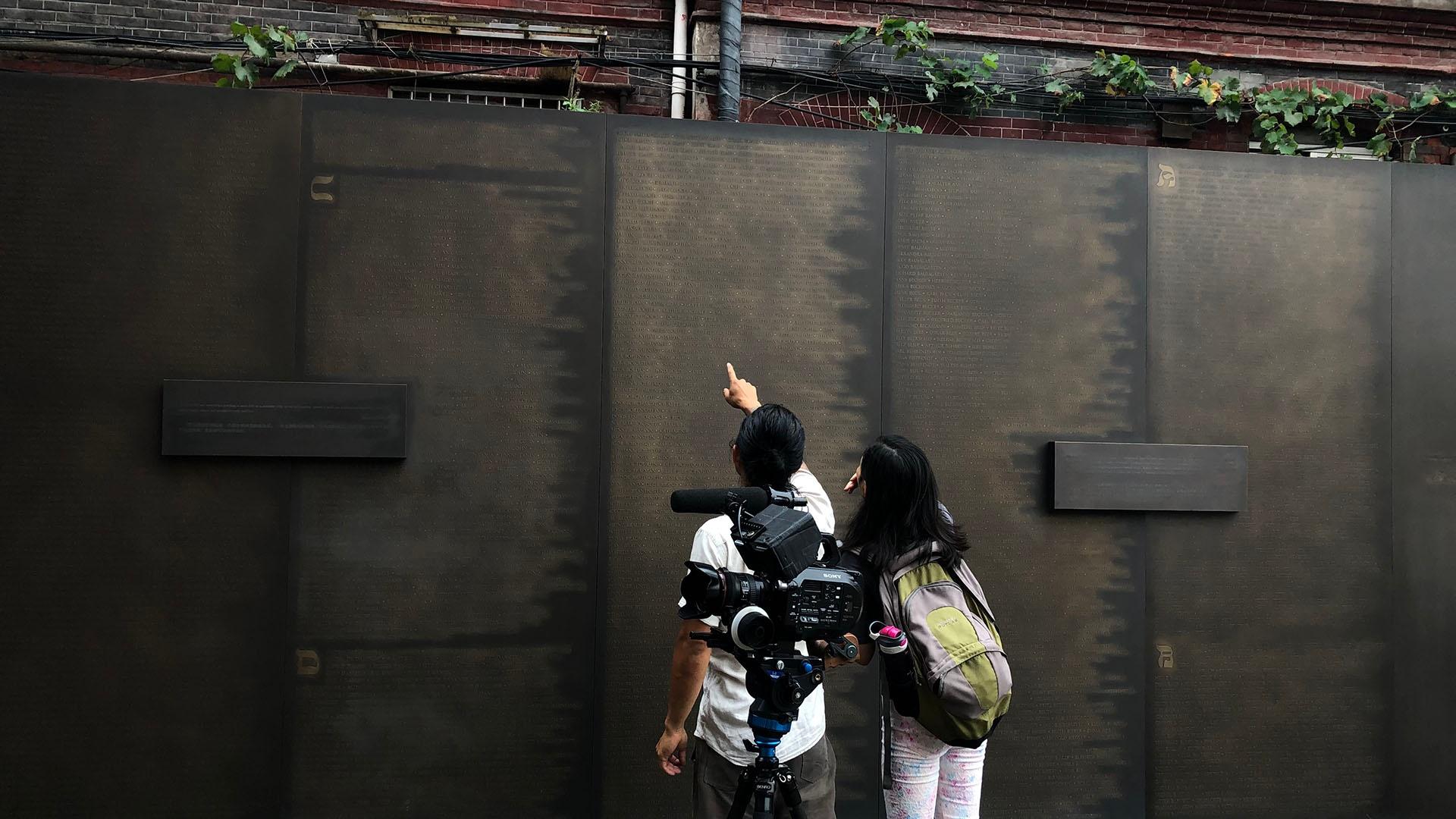 Violet and one of the directors of photography, Jason Wong, at the Shanghai Museum Wall.