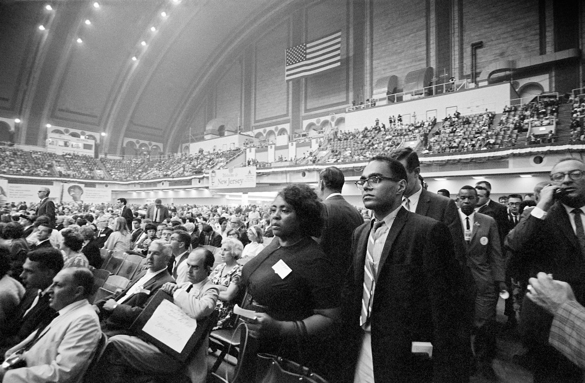 August 10, 1964. MFDP delegates challenge Mississippi Democrats at Democratic Convention. Inside convention hall: Fannie Lou Hamer and Bob Moses assess the Mississippi seating situation.